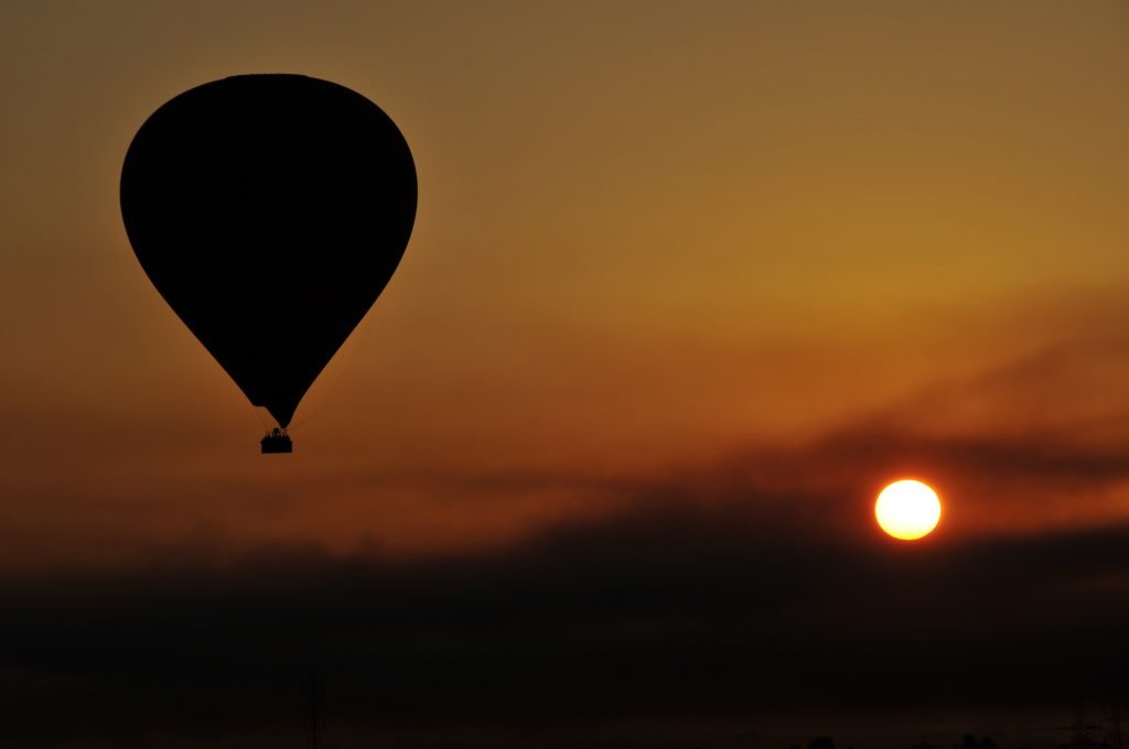 Hot air balloon above Luxor at sunrise